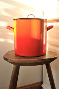 Red and yellow enamelware bin